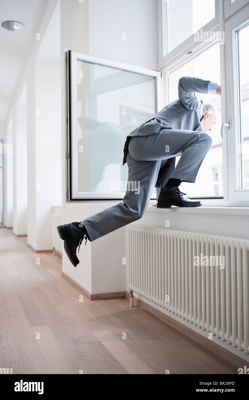 Climbing Out Window High Resolution Stock Photography and Images Alamy