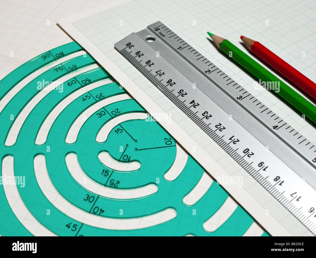 Geometry tools on paper with red and green pencil Stock Photo - Alamy