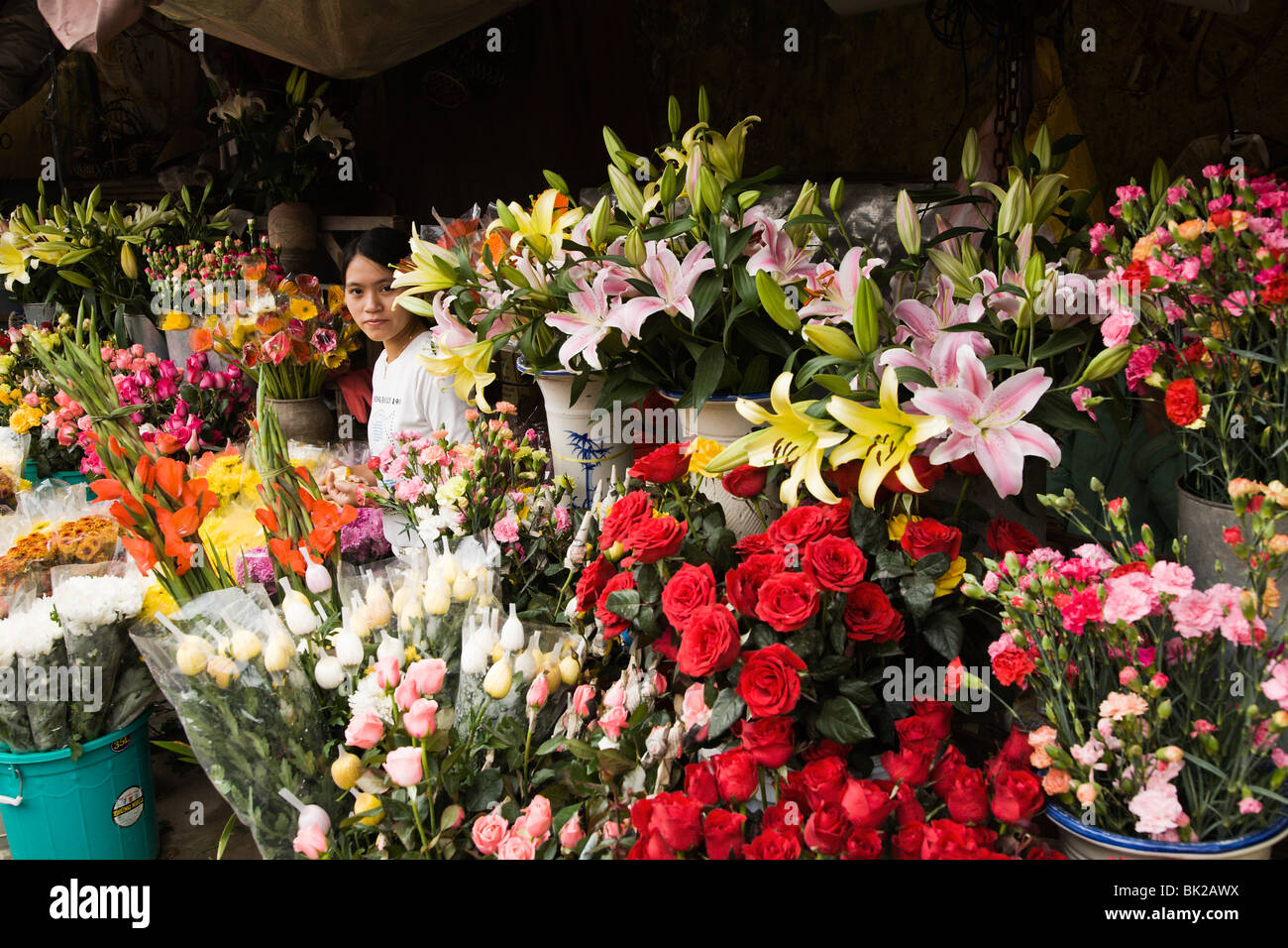 Girl selling flowers at the Central Market in Hoi An Vietnam Stock Photo Alamy