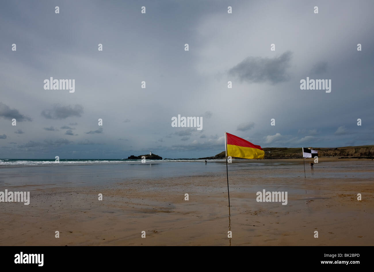 RNLI warning flags on Gwithian Towans Beach in Cornwall. Photo by