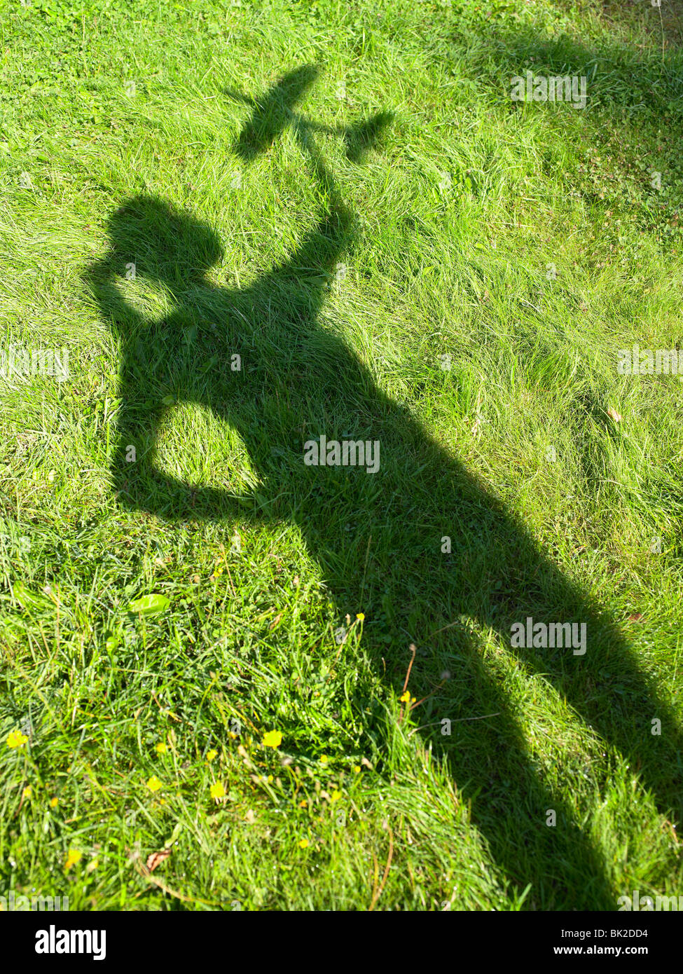 Shadow of a woman holding an rc plane Stock Photo