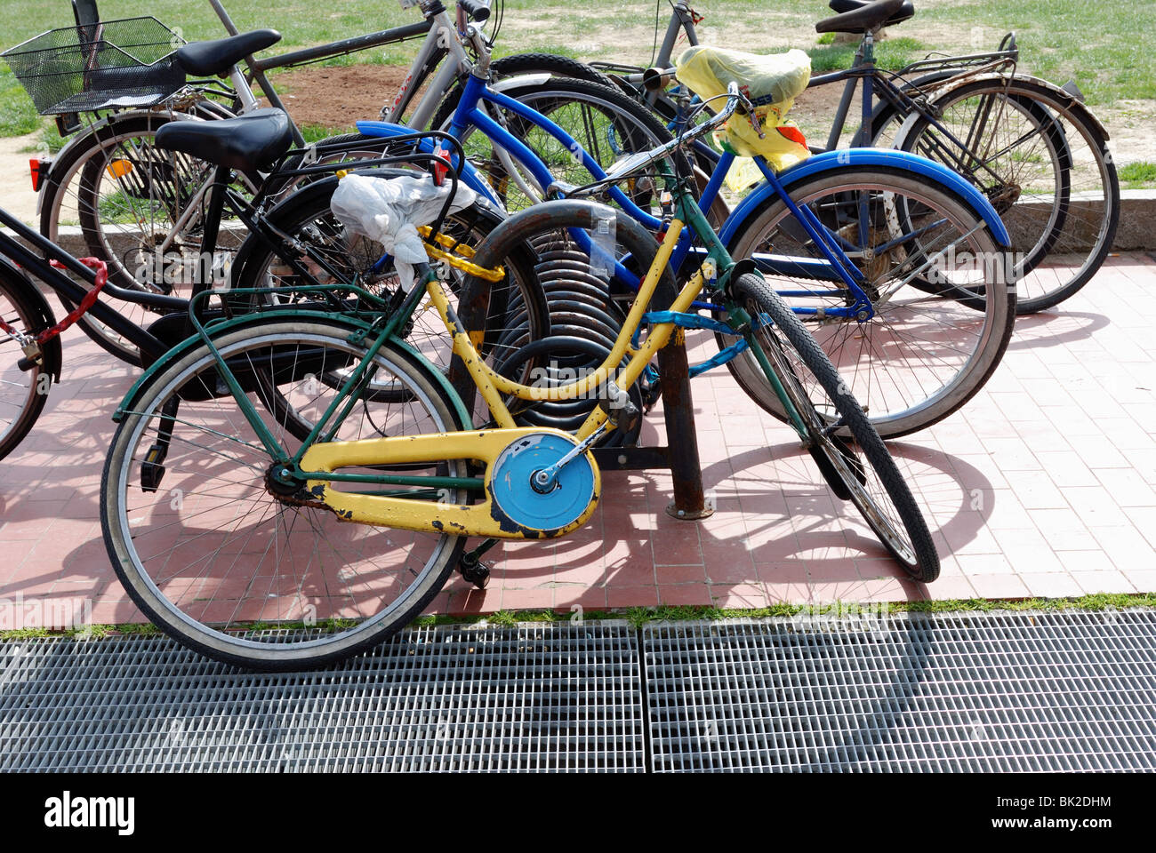 Chained bicycles in Florence, Italy, in front of train station Stock Photo