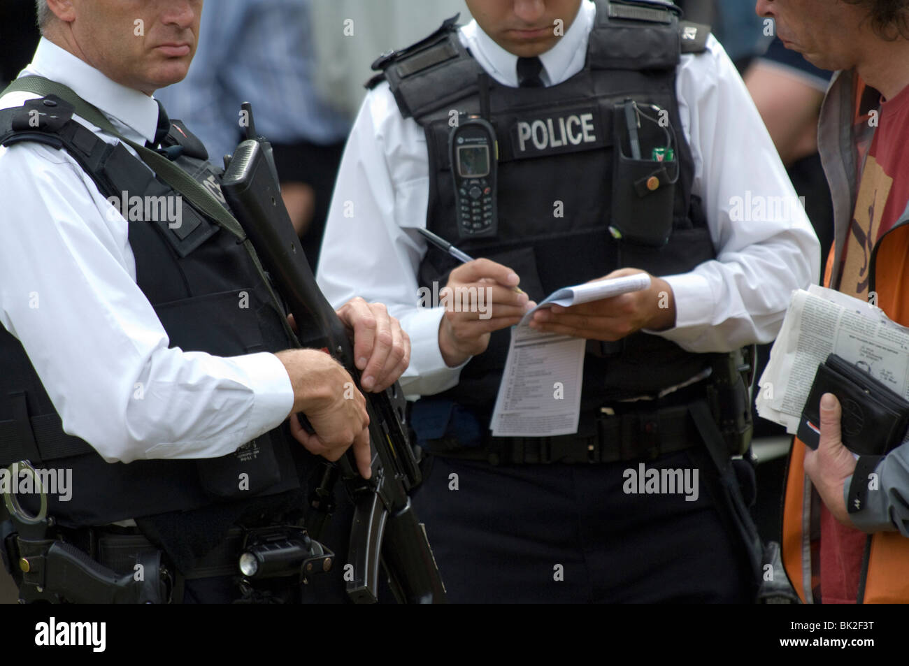 Armed police issue a stop and search ticket at the Trooping the Colour ceremony in honour of the Queens Birthday Stock Photo