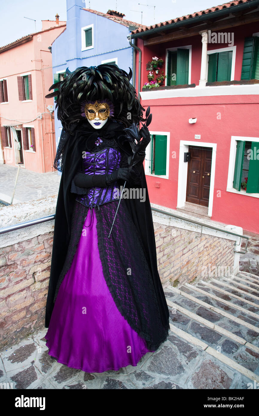 A masked woman in a black costume at the carnival in Burano, Venice, Italy,  Europe Stock Photo - Alamy