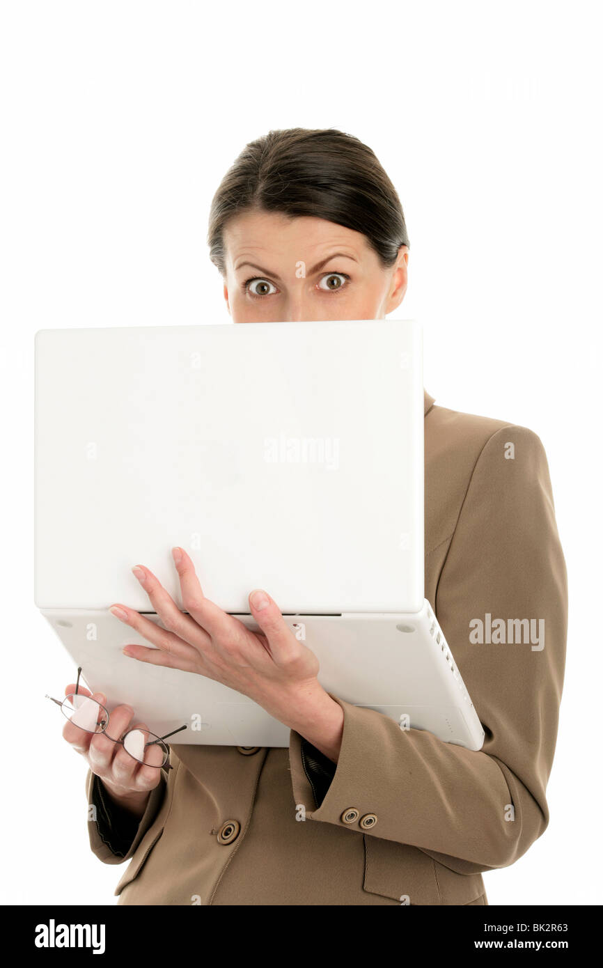 Portrait of mature scared businesswoman using laptop isolated on white background Stock Photo