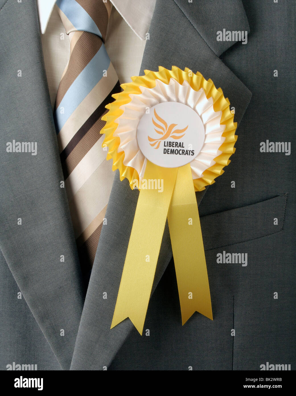 Yellow Liberal Democrats Rosette pinned to Jacket. Stock Photo