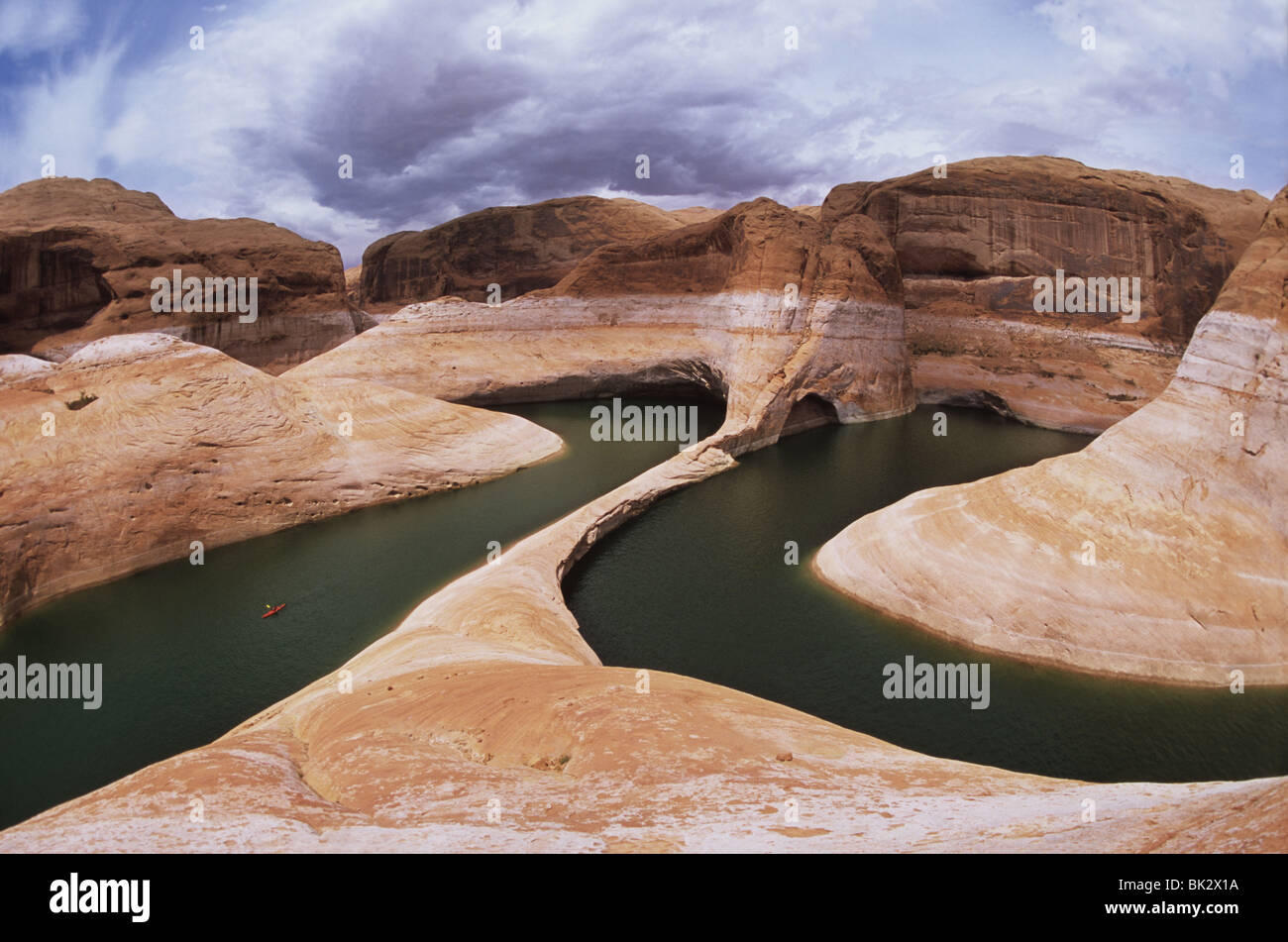 Kayaking (lower left) in Reflection Canyon beneath the towering 140