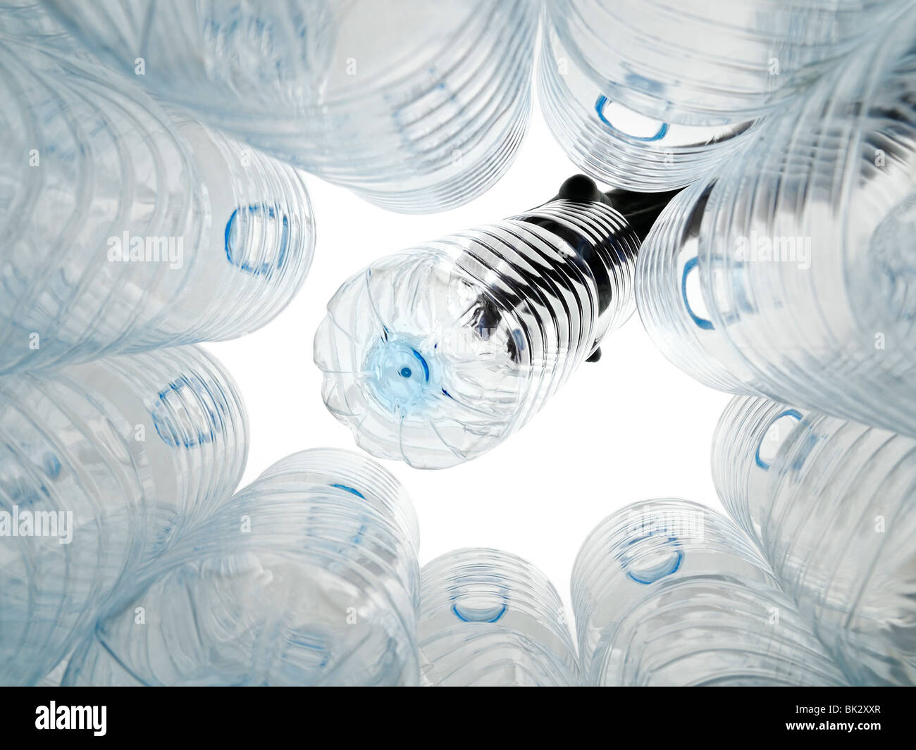 Plastic Bottle Being Put Into a Recycling Bin Stock Photo