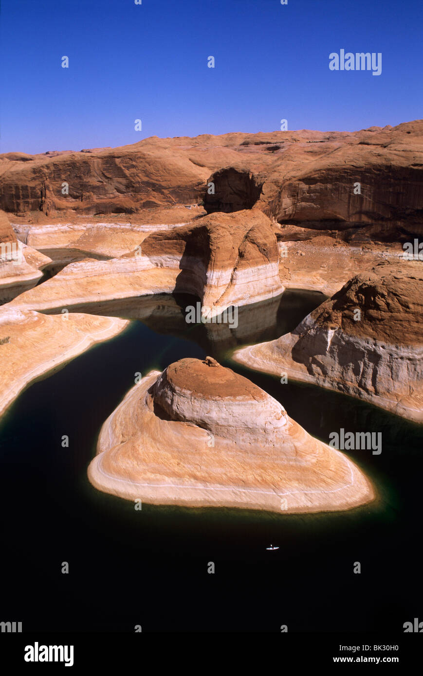 Small white kayak (bottom right) in Reflection Canyon on Lake Powell