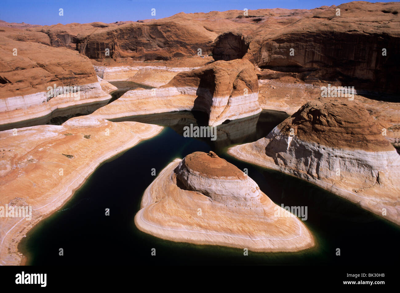 Kayaking (lower left) on Lake Powell in Reflection Canyon beneath 110
