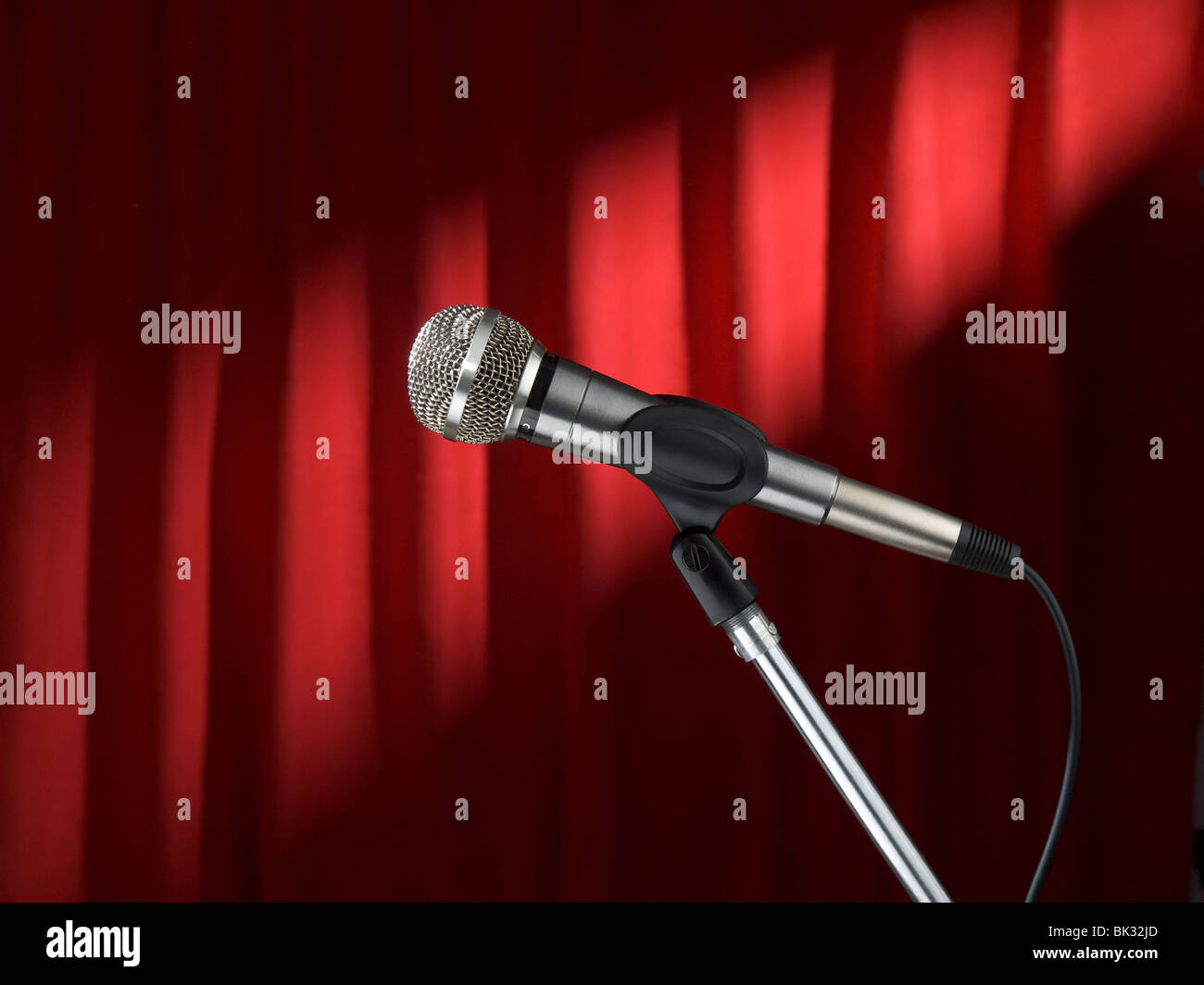 A dynamic microphone over a red background Stock Photo Alamy