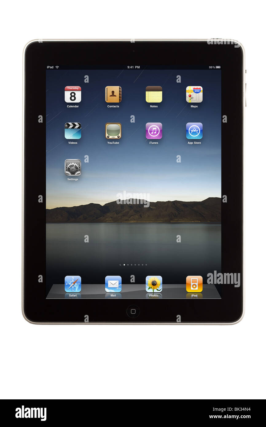 An iPad tablet computer and its home screen with default install applications Stock Photo
