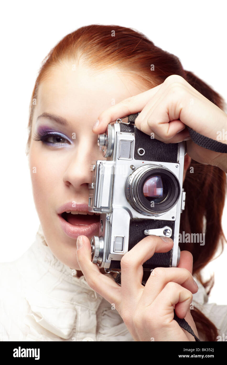 Beautiful young woman with camera. Stock Photo