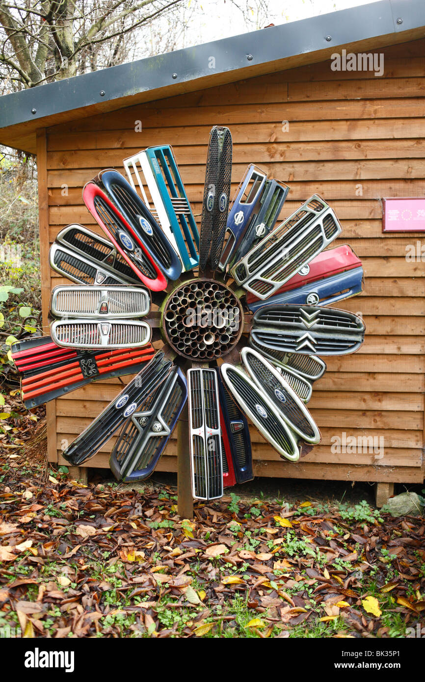 Sculpture made from scrap car parts, on display at an urban nature reserve. Powys, Wales. Stock Photo
