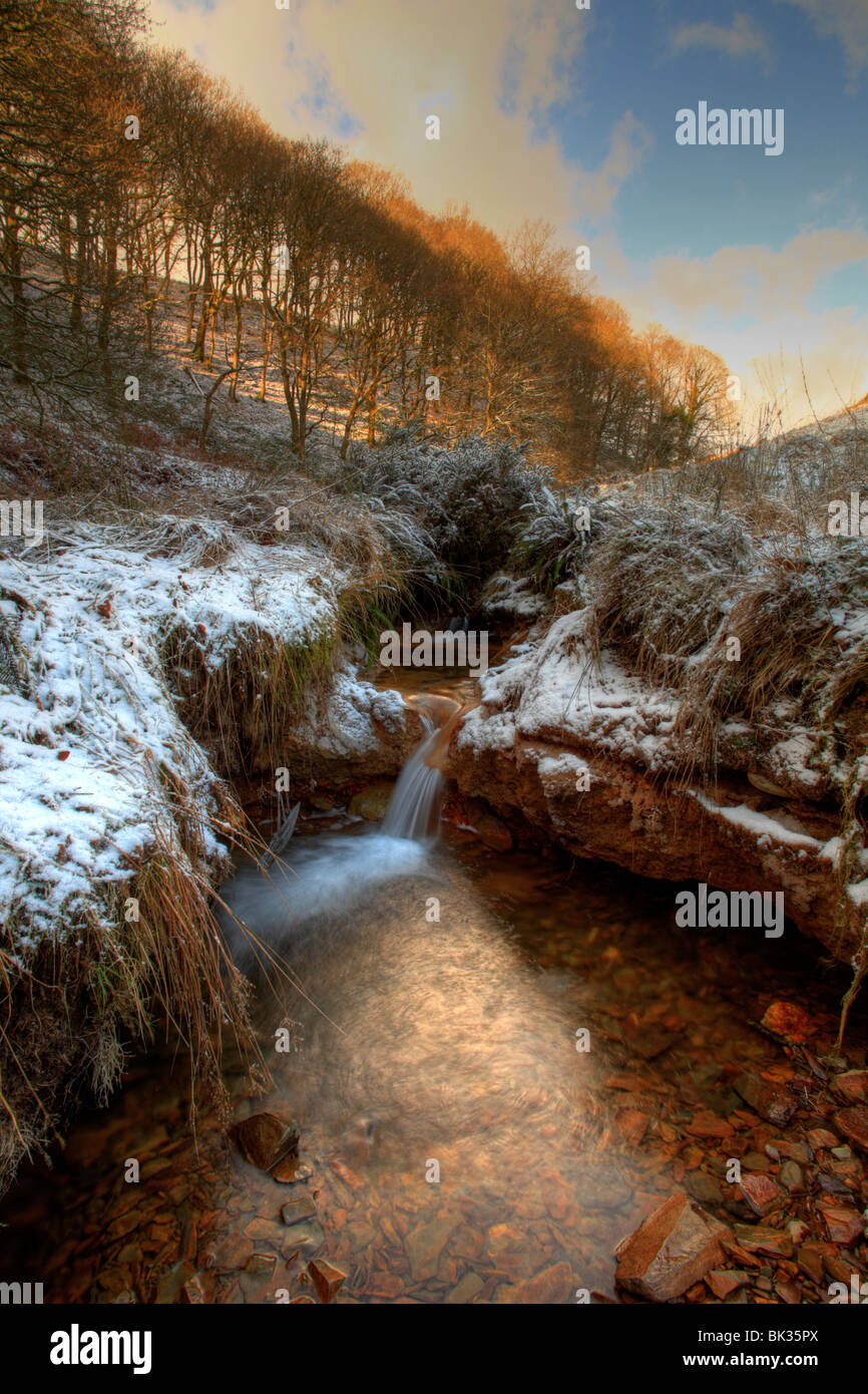 Ice and snow beside an upland stream. Near Llanidloes, Powys, Wales. Stock Photo