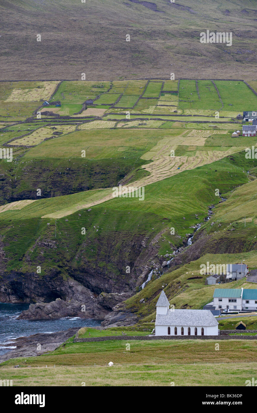 Vidareidi and church dating from 1892, Vidoy Island, Nordoyar, Faroe Islands (Faroes), Denmark, Europe Stock Photo