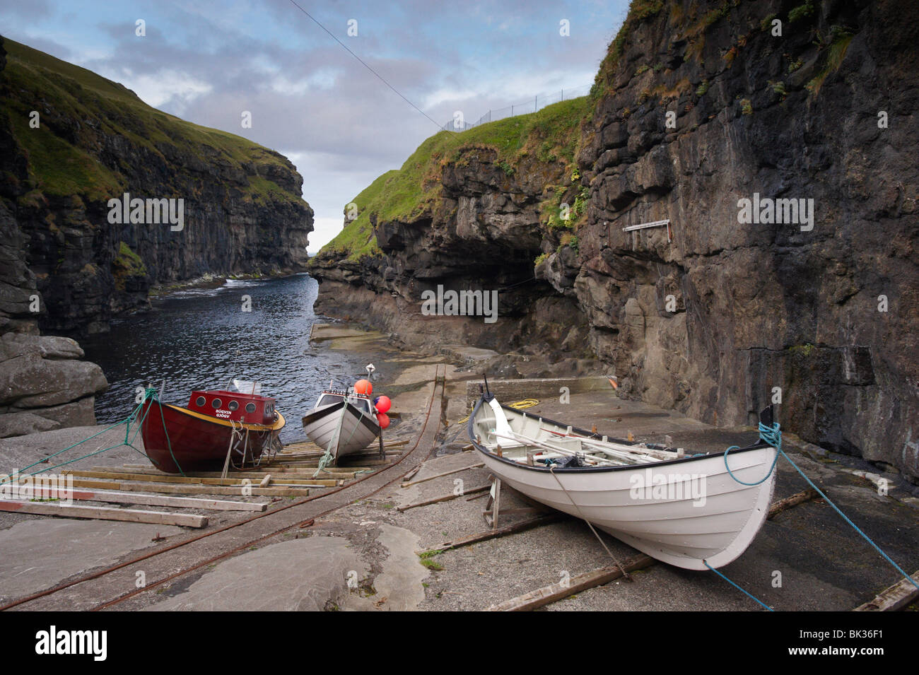 Gjogv harbour, set in a 200m-long natural cleft in the rock, Eysturoy, Faroe Islands (Faroes), Denmark, Europe Stock Photo
