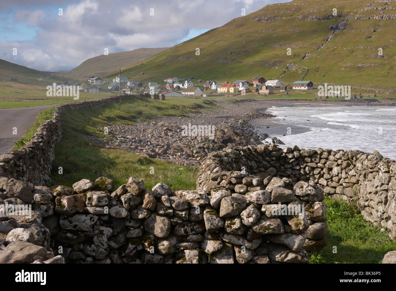 Dry stone walls and village of Husavik, Sandoy, Faroe Islands (Faroes), Denmark, Europe Stock Photo