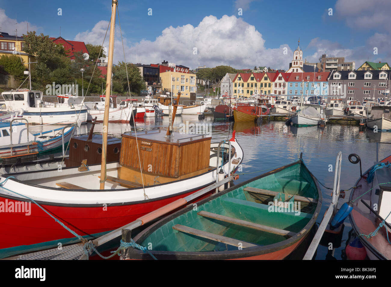 Colourful boats and picturesque gabled buildings along the quayside in Vestaravag harbour, Torshavn, Streymoy, Faroe Islands Stock Photo