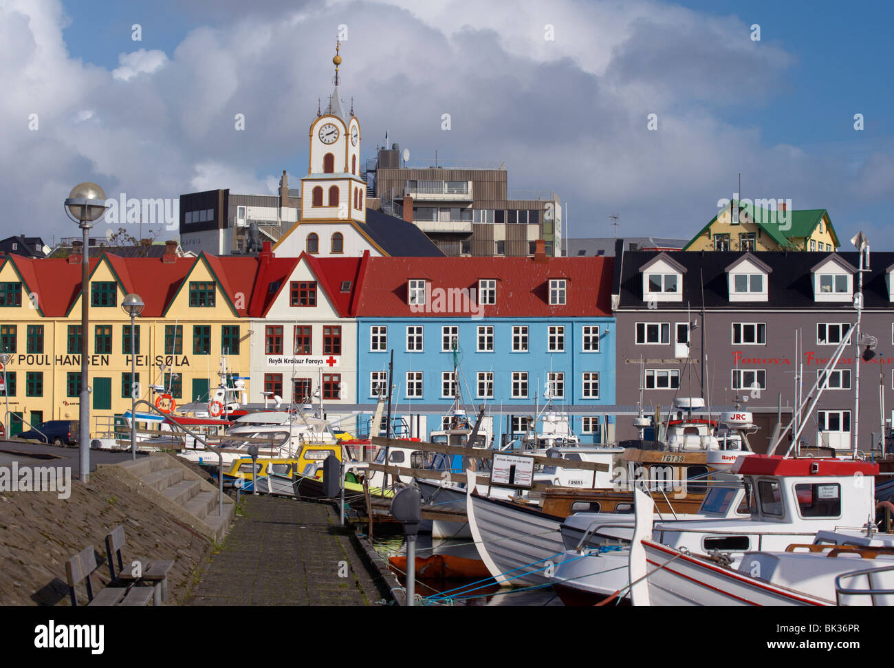 Colourful boats and picturesque gabled buildings along the quayside in Vestaravag harbour, Torshavn, Streymoy, Faroe Islands Stock Photo