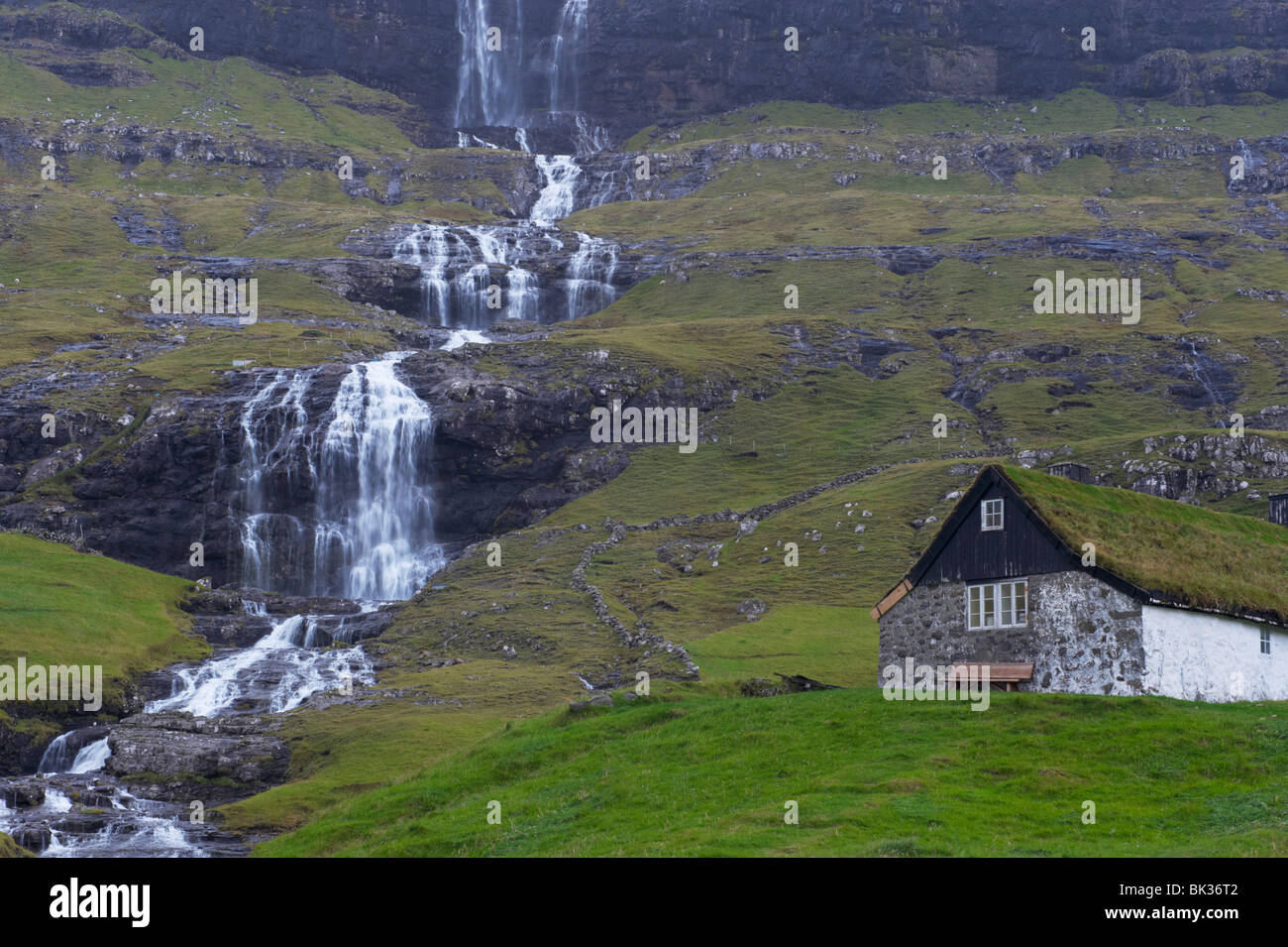 Old farm at Saksun and waterfall, Streymoy, Faroe Islands (Faroes), Denmark, Europe Stock Photo