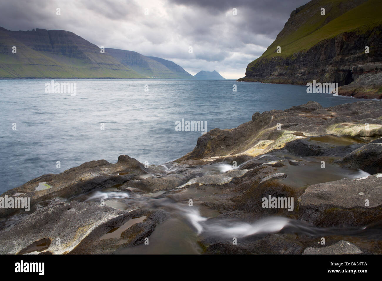 Kalsoyarfjordur, with Kalsoy on the right, and Kunoy islands from Mikladalur on Kalsoy, Nordoyar, Faroe Islands Stock Photo
