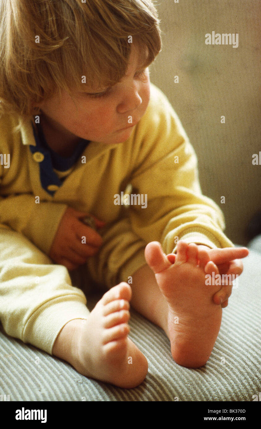 Little boy counting toes toddler exploring Toddler feet Stock Photo Alamy