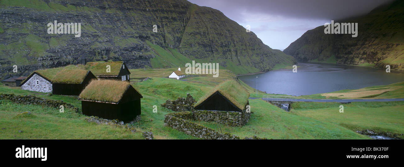 Traditional turf roofed farm buildings and church, Saksun, Streymoy Island, Faroe Islands (Faroes), Denmark, Europe Stock Photo