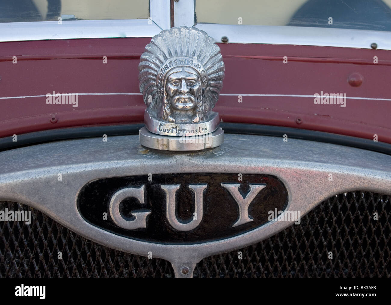 Guy Motors radiator cap in the shape of a Red Indian in his Feathered Headdress with the slogan Feather In Our Cap Stock Photo