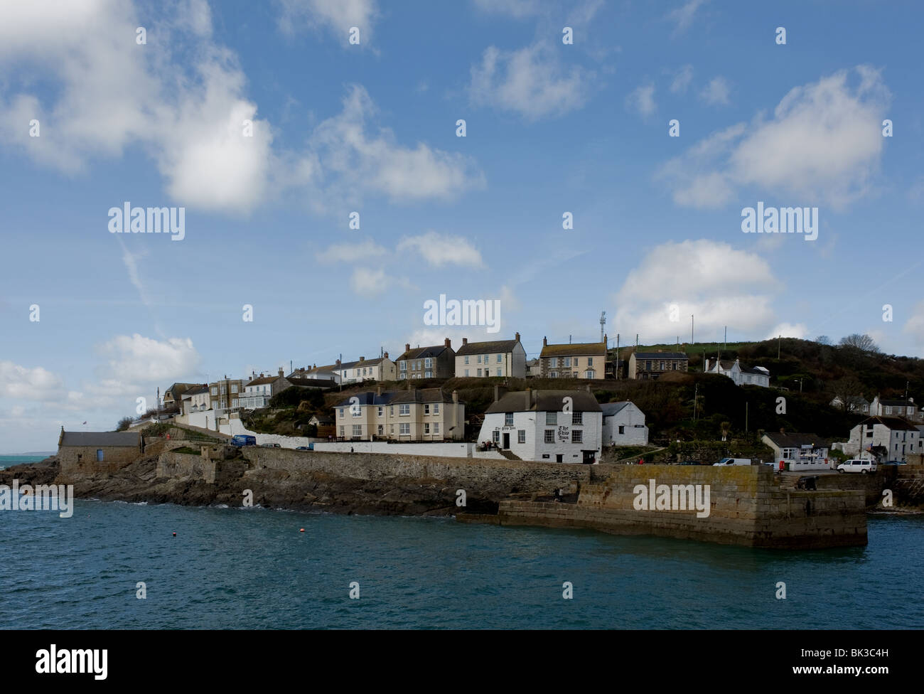 Houses at the entrance to Porthleven Harbour in Cornwall. Photo by