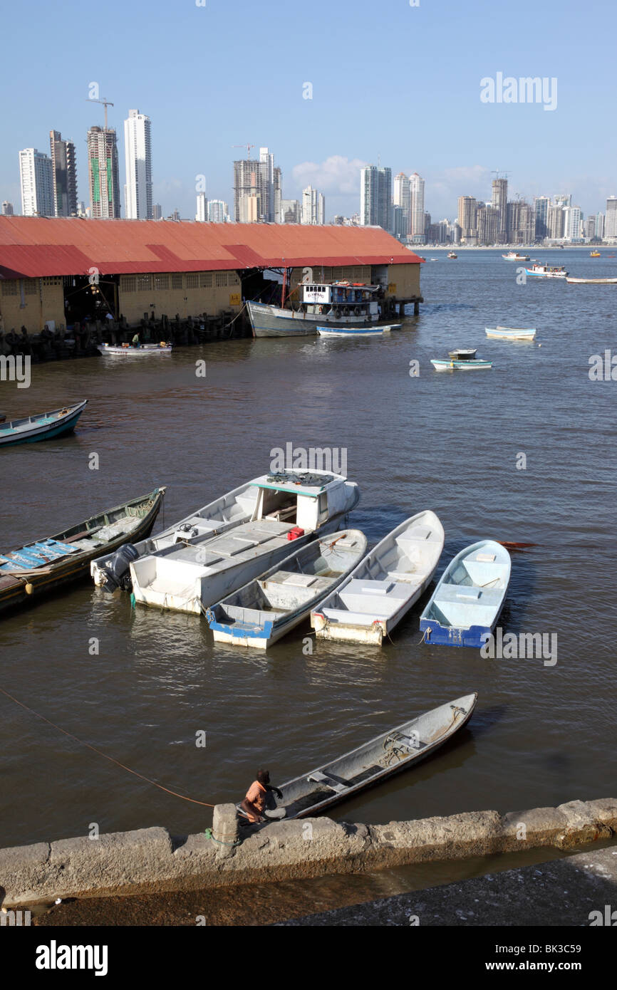 Fishing boats in docks , Paitilla skyscrapers in background , Panama City , Panama Stock Photo