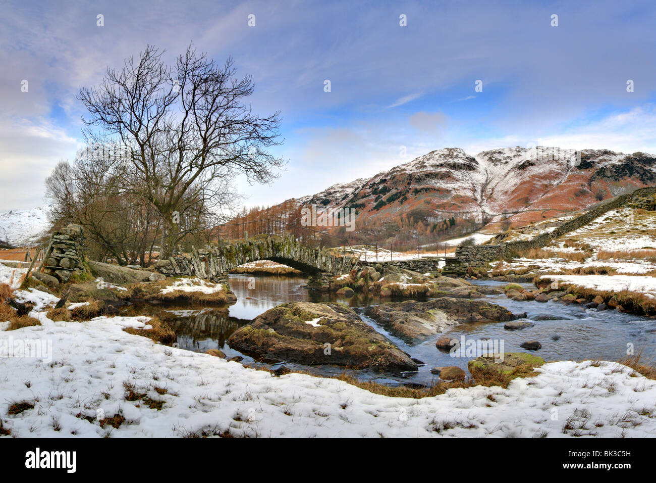 Slaters Bridge, Little Langdale, River Brathay, Lake District National Park, UK, Winter, snow on the ground. Stock Photo