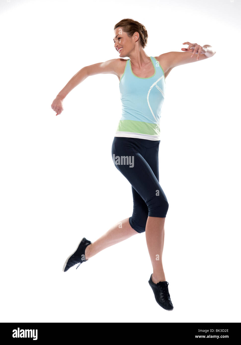 woman running on studio white isolated background Stock Photo