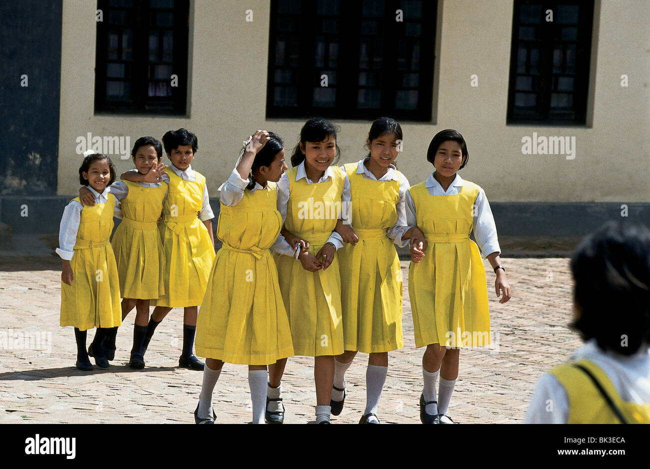 Nepalese school children girls wearing yellow dresses and uniforms in  Kathmandu, Nepal Stock Photo - Alamy