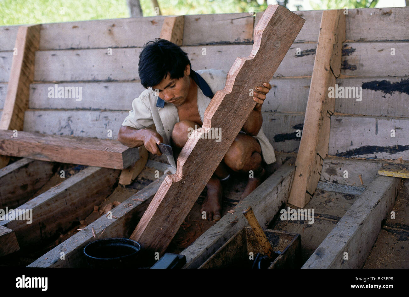 Wood worker or boat builder in the Amazon Region of Peru Stock Photo