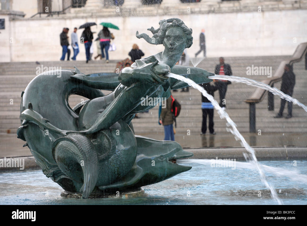 Trafalgar Square, fountain statue water, gushing London, Capital City, England UK Stock Photo