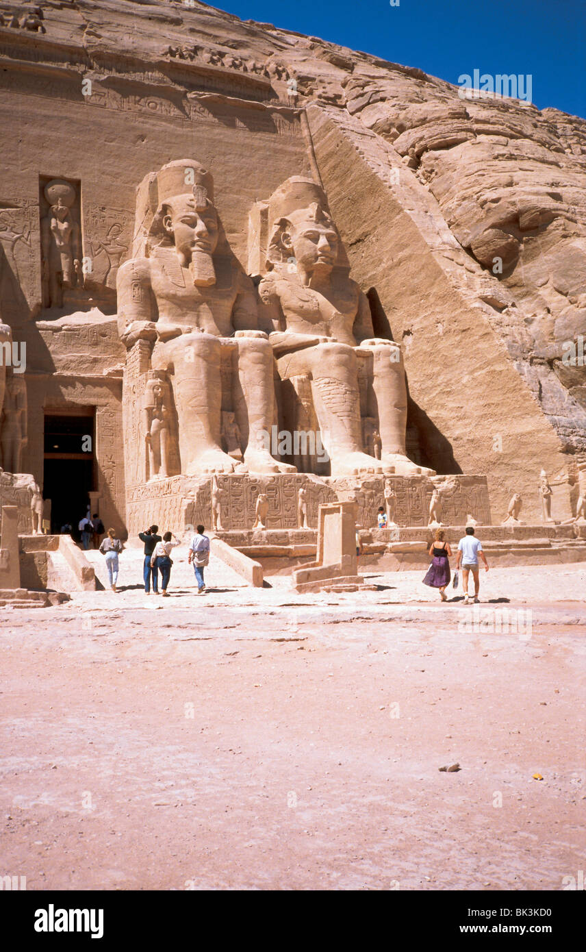Two massive rock-cut sculptures at the historic site of the Temple of Ramesses II at Abu-Simbel, Egypt Stock Photo