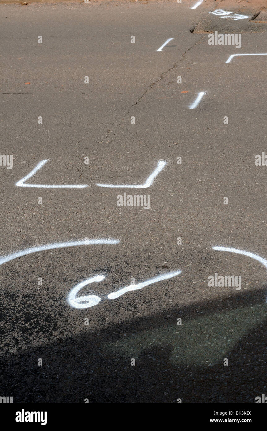 markings showing the site of Potholes waiting to be repaired,	 pot, holes, hole, road, damage, uk, pothole, road potholes Stock Photo