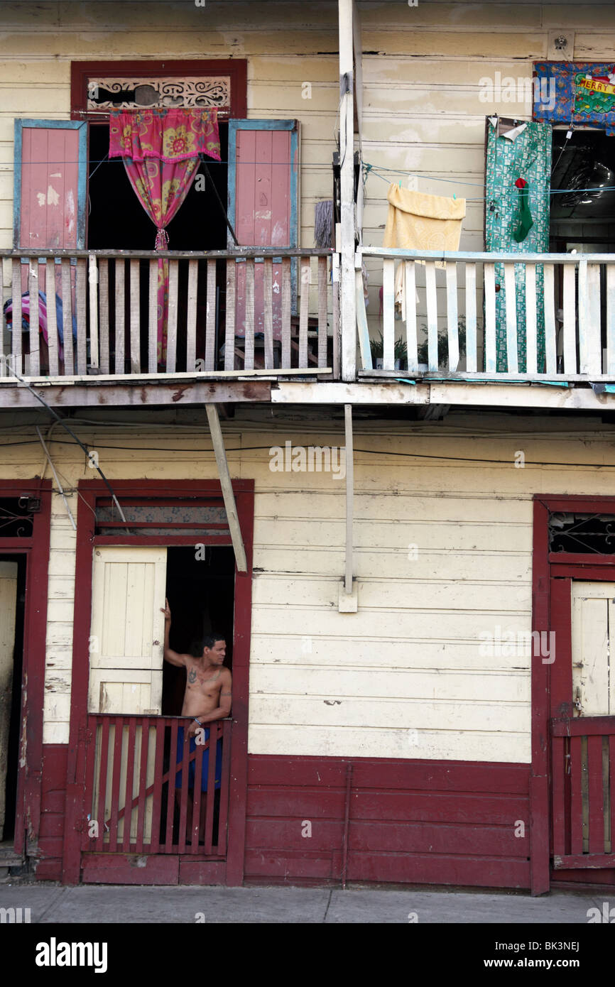Man standing in door of wooden house , Casco Viejo , Panama City , Panama Stock Photo