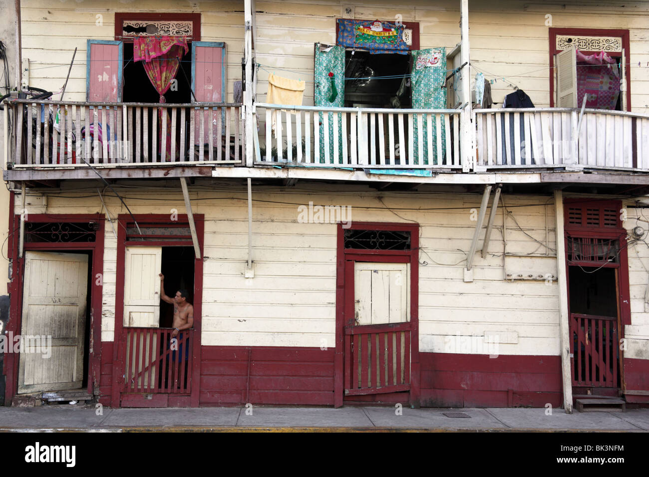 Man standing in doorway of wooden house , Casco Viejo , Panama City , Panama Stock Photo