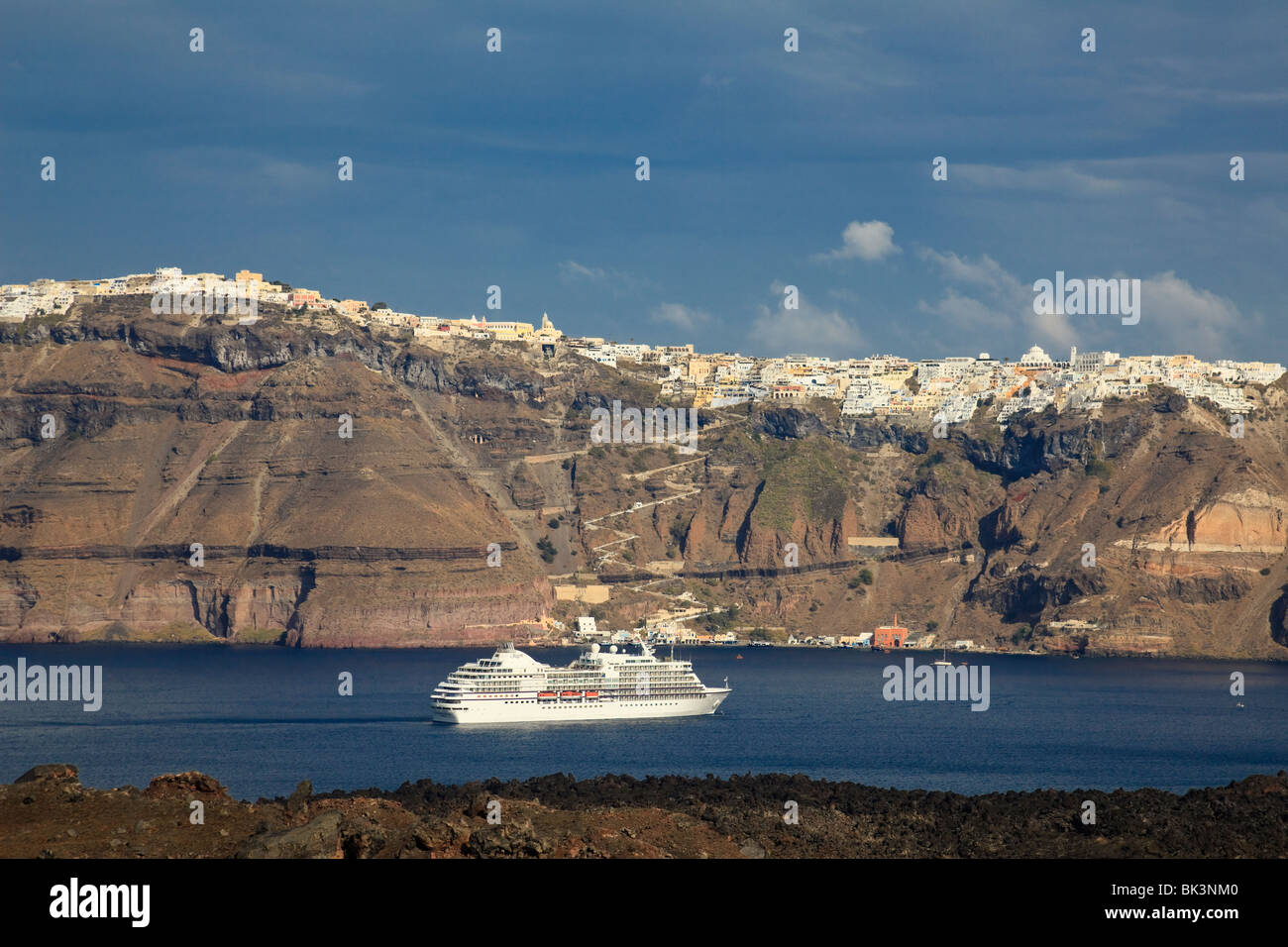 Cruise ship below Thira (Fira) on Santorini,Greece Stock Photo