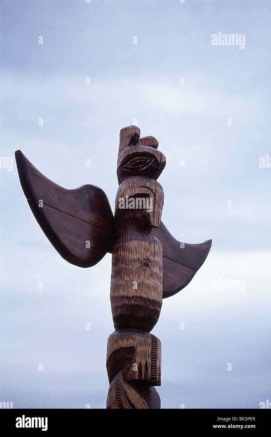 Detail of the top of a carved wooden totem pole sculpture in Alaska ...