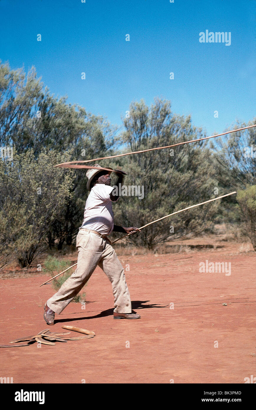 An Aborigine man using a throwing sling with a spear in Rod Steinert's
