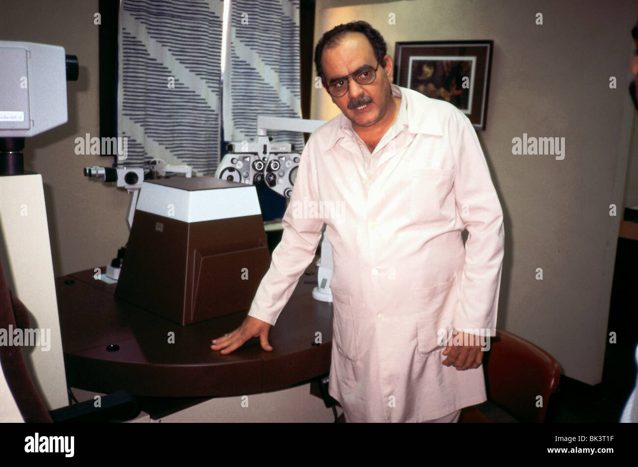 Doctor with optometric equipment in the Topes Medical Clinic, Cuba Stock Photo