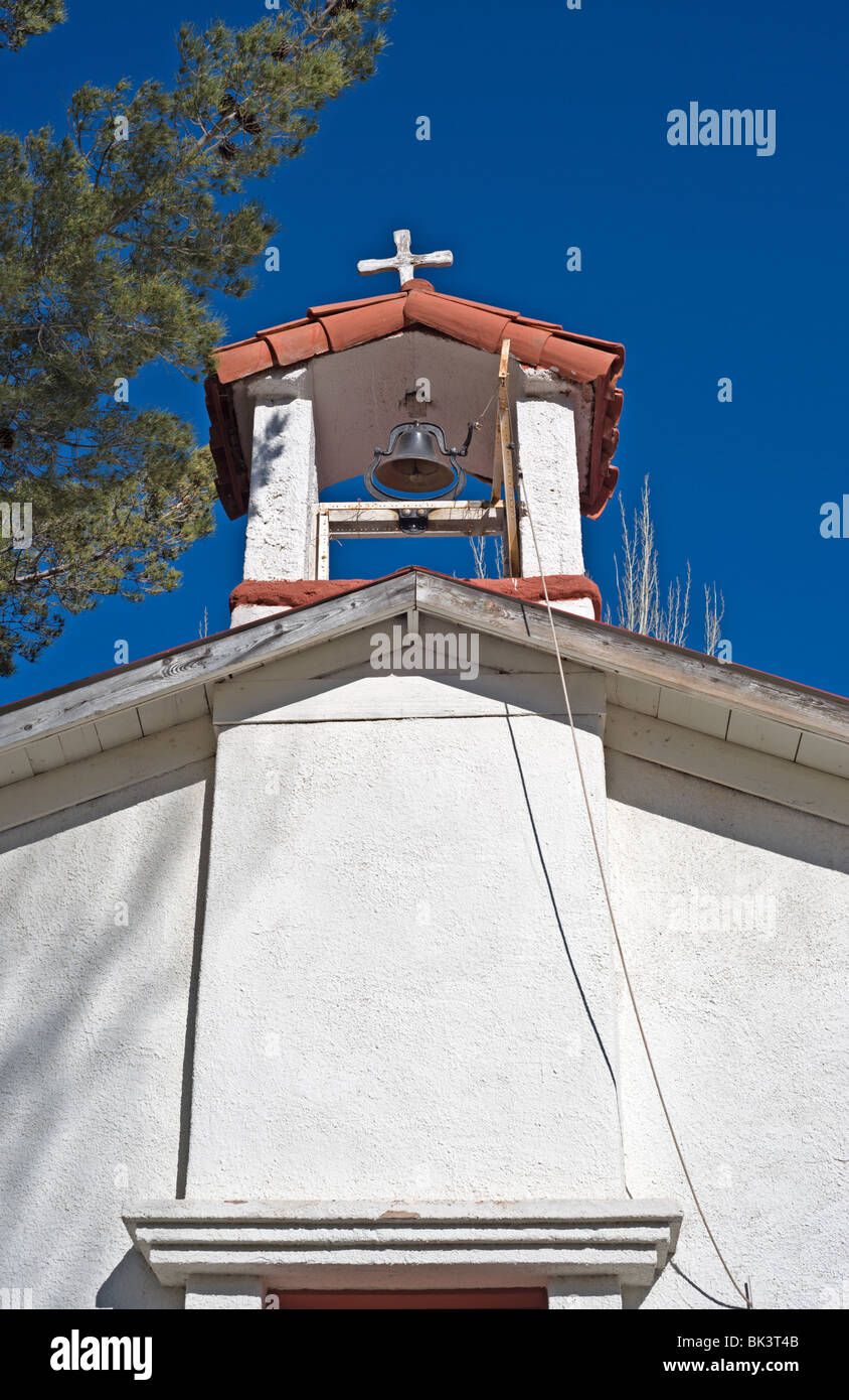 Built in 1911, the white adobe Santo Nino de Atocha church stands under a blue sky near Three Rivers, New Mexico. Stock Photo