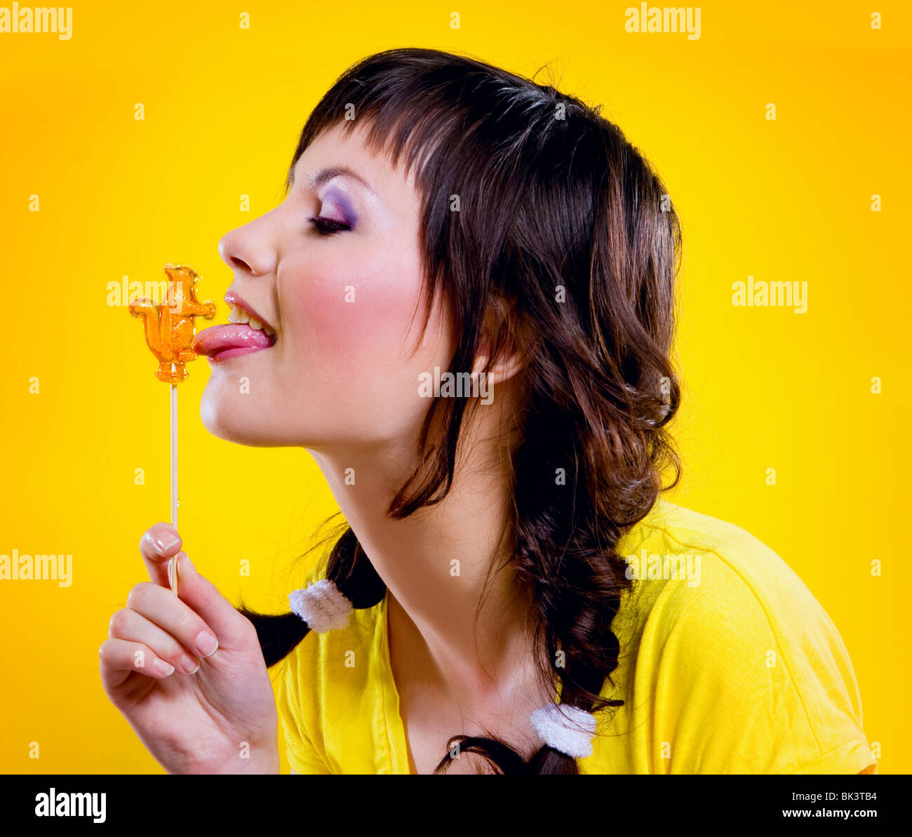 portrait of beautiful girl on yellow background Stock Photo - Alamy