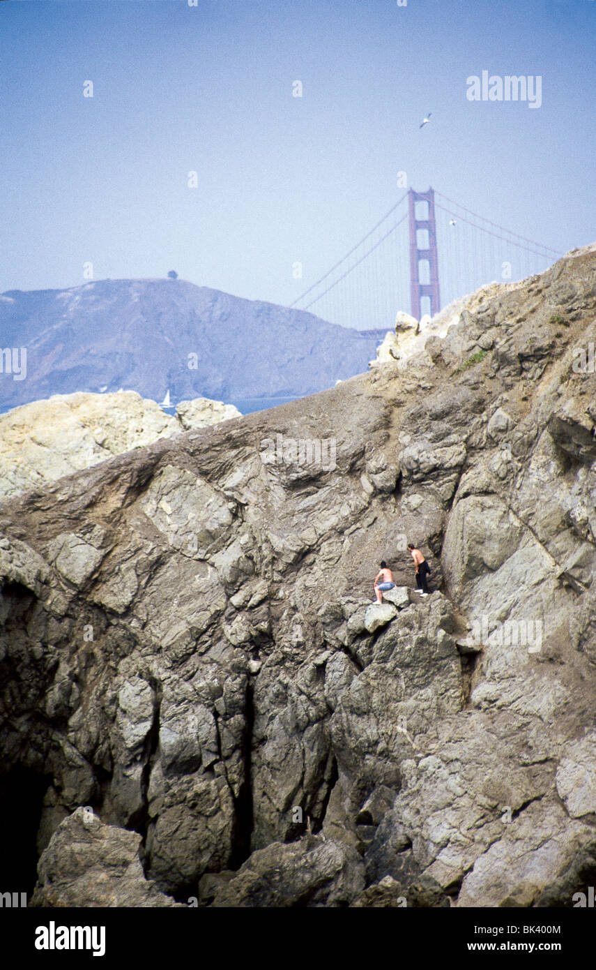Two people rock climbing at the edge of San Francisco Bay, California Stock Photo Alamy