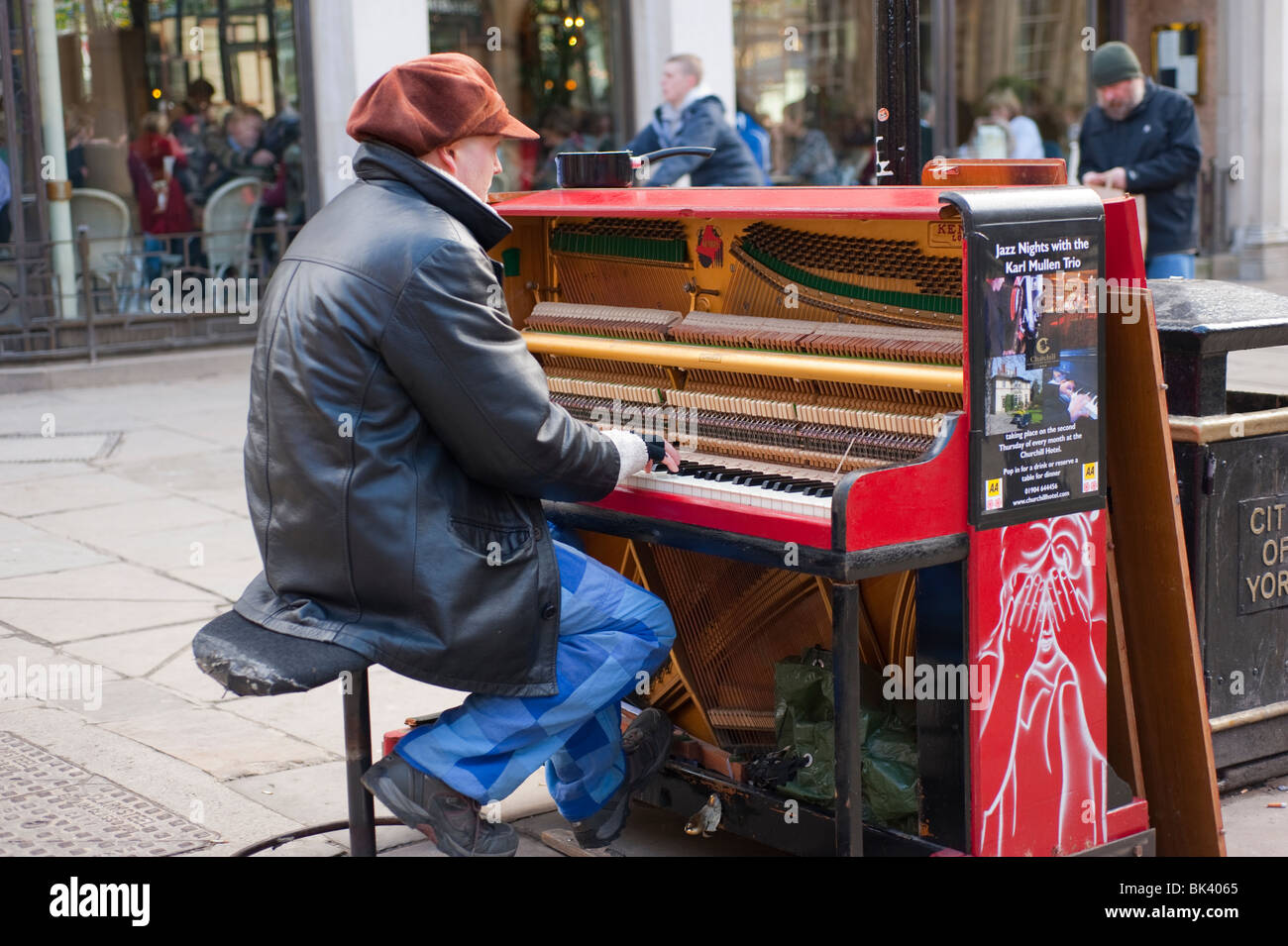 Street entertainer playing upright piano in public shopping area Stock  Photo - Alamy