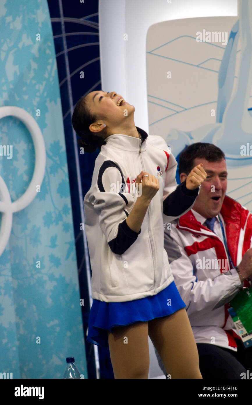 YuNa Kim (KOR) with her coach Brian Orser in the kiss and cry after