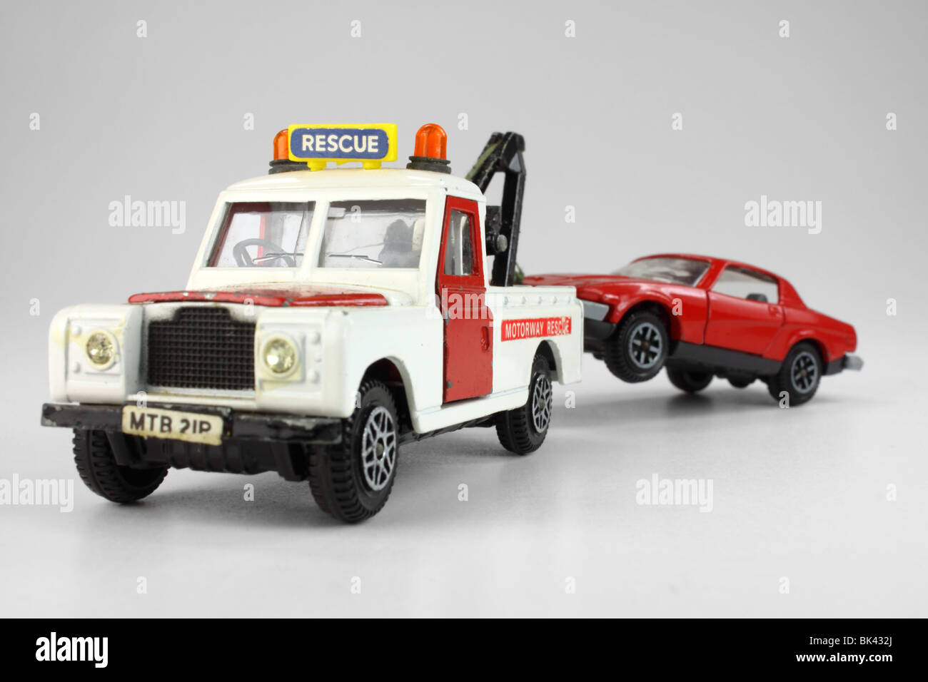 toy recovery truck and broken down car Stock Photo